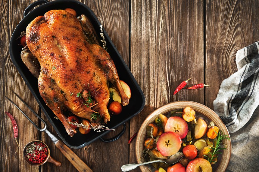 Roast Christmas duck with apples